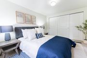 Boise apartment for rent - Bedroom with blue accents and builtin closet at Edgewater Apartments, Boise, ID