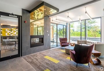 Cambridge apartment for rent - a living room with couches and chairs and a fireplace