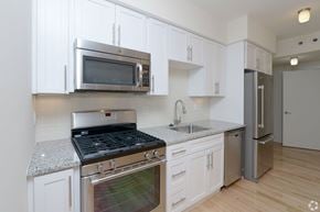 Cambridge apartment for rent - A kitchen with white cabinets and stainless steel appliances at 603 Concord Apartments, Cambridge 02138