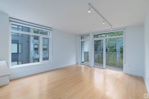 Cambridge apartment for rent - A spacious room with wooden floors and large windows at 605 Concord at Fresh Pond, Cambridge