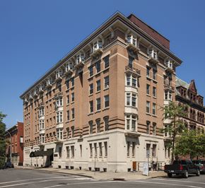 Troy apartment for rent - a large brick building on the corner of a city street