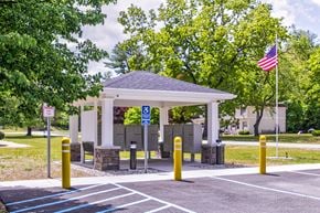 Gansevoort apartment for rent - A gazebo is surrounded by a parking lot with a flag flying in the background.