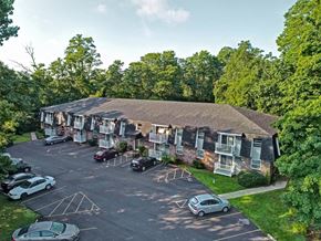 Schenectady apartment for rent - an aerial view of an apartment building and parking lot