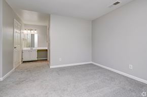 Middletown apartment for rent - a bedroom with white walls and carpet and a bathroom at Boulder Pointe Apartments in Middletown, NY 10940