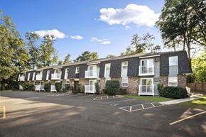 Schenectady apartment for rent - the outlook of an apartment building with a parking lot