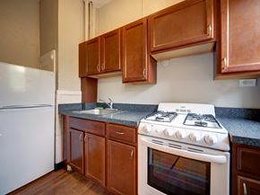 Troy apartment for rent - A white stove with a white oven in a kitchen.