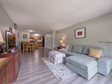 Troy apartment for rent - a living room and dining room with a couch and a table