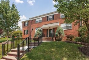 Wood-Ridge apartment for rent - the front of a brick house with stairs and a yard