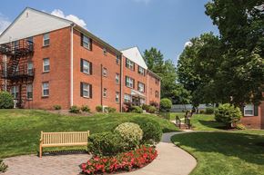 Wood-Ridge apartment for rent - a brick building with a sidewalk in front of it