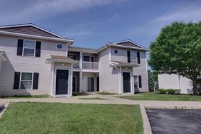 Cohoes apartment for rent - an apartment building with white siding and a sidewalk