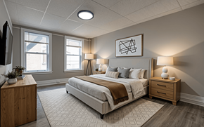 Albany apartment for rent - A bedroom with a large bed, a wooden nightstand, and a window.