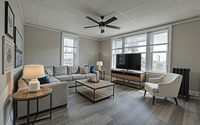 Albany apartment for rent - A living room with a grey couch, a coffee table, a television, and a chair.