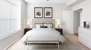 Chapel Hill apartment for rent - A bedroom with a large bed and two pictures on the wall.