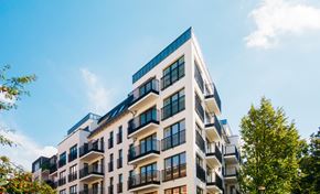 Boynton Beach apartment for rent - A modern multi-story building with balconies and windows.