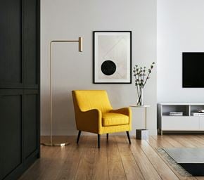 Santa Barbara apartment for rent - a yellow chair in a living room with a lamp and a television