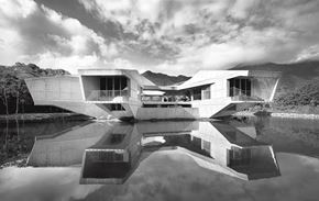 Chapel Hill apartment for rent - A black and white image of a modern building with a reflective pool in front.