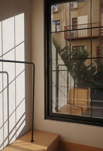 Chapel Hill apartment for rent - A window with a view of a balcony and a building outside.