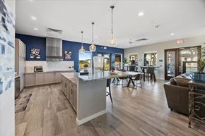 Prescott Valley apartment for rent - a kitchen with a center island and a dining table