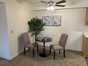 Cave Creek apartment for rent - A dining room with a table, chairs and a ceiling fan.