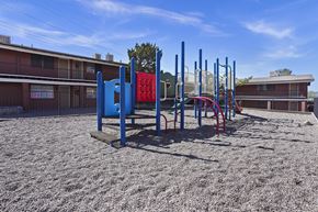 El Paso apartment for rent - an empty playground at a school with a building in the background