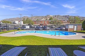 El Paso apartment for rent - a pool with mountains in the background at an apartment complex