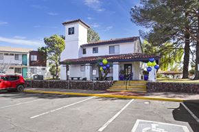 El Paso apartment for rent - a parking lot in front of a building with balloons