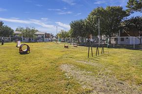 El Paso apartment for rent - a yard with a playground and a chain link fence