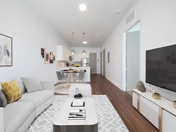 Birmingham apartment for rent - A modern living room with a grey sofa and a coffee table.