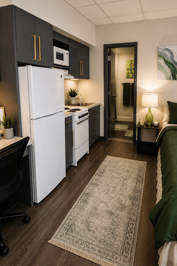 Birmingham apartment for rent - A kitchen with a white fridge and a black chair.