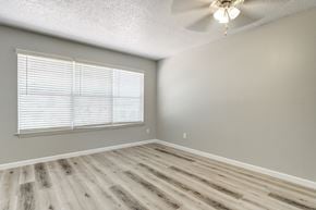 El Paso apartment for rent - an empty bedroom with wood floors and a large window