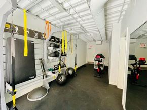Chicago apartment for rent - a gym with weights and other equipment in a garage