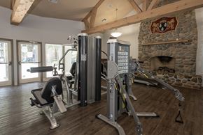 Rancho Cordova apartment for rent - Fitness center machines and fireplace at Bishop's Court Apartments, Rancho Cordova, 95670