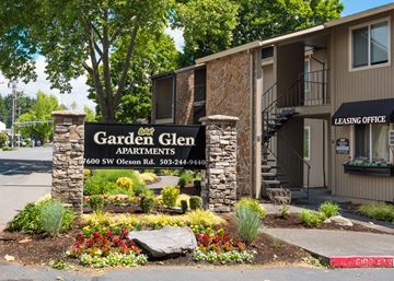 Portland apartment for rent - A sign for Garden Glen Apartments is in front of a building.