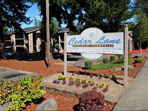 Portland apartment for rent - A sign that says Cedar Lane in front of a building.