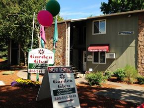 Portland apartment for rent - A sign for Garden Glen Apartment Community is displayed in front of a building.