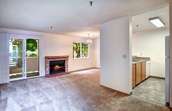 Living room & dining room with cozy carpet and a fireplace