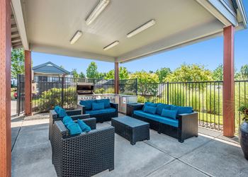 Outdoor kitchen adjacent to pool deck