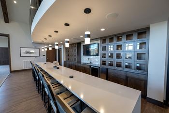 Club room with billiards, bar, poker, and shuffleboard
