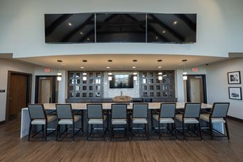 Club room with billiards, bar, poker, and shuffleboard