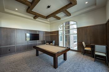 Club room with billiards, bar, poker, and shuffleboard