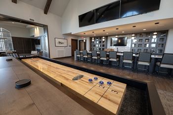 Club room with billiards, bar, poker, and shuffleboard