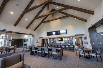 Club room with billiards, bar, poker, and shuffleboard