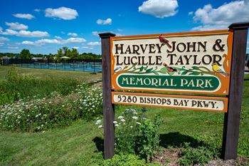 Adjacent to harvey john & lucille taylor park offering pickleball courts, full basketball court, football field, picnic shelter, and playground