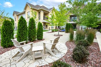 Outdoor oasis with hammocks & adirondacks