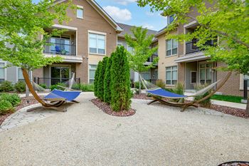 Outdoor oasis with hammocks & adirondacks
