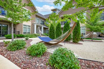 Outdoor oasis with hammocks & adirondacks