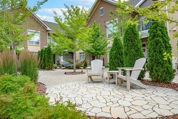 Outdoor oasis with hammocks & adirondacks