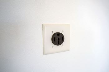 Upsized power in garage outlets to quick-charge electric vehicles in townhomes