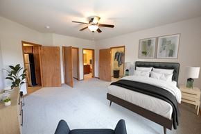 Middleton apartment for rent - a large bedroom with a bed and a ceiling fan