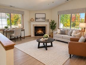 Menomonee Falls apartment for rent - A cozy living room with a fireplace and comfortable seating.